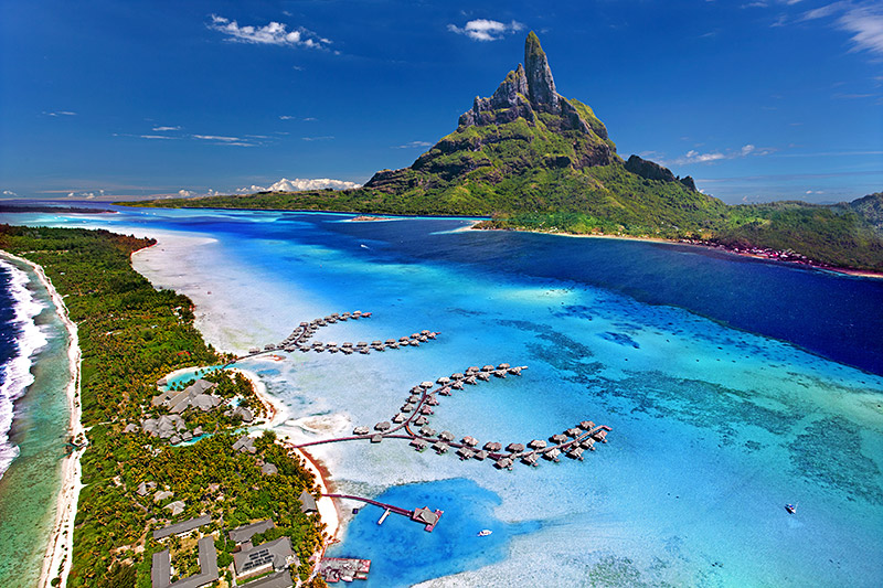 Turquoise lagoon and green peak at Bora Bora in French Polynesia