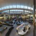 UK ETA: Who Needs It in 2026, the £20 Fee and How to Apply Traveller using a smartphone app beside a passport before a trip to the UK
